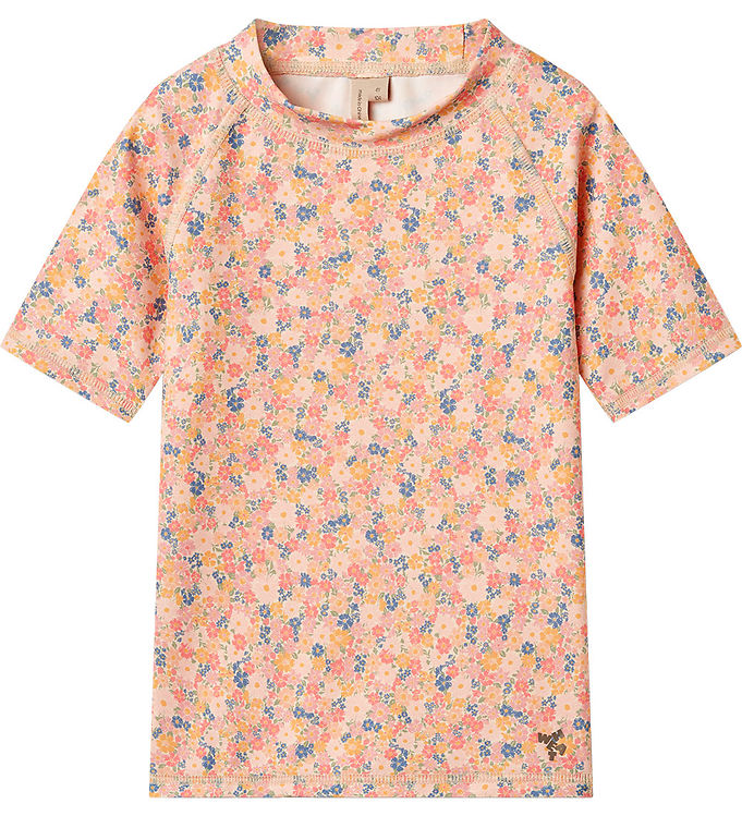 Badebluse UV40+ Jackie SS Multi Flowers fra Wheat